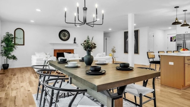 90 Fox Farms Rd, Northampton, MA 01062 - dining space with light wood finished floors, recessed lighting, a brick fireplace, baseboards, and a chandelier