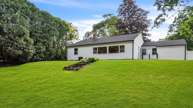 90 Fox Farms Rd, Northampton, MA 01062 - rear view of house featuring a lawn and a chimney