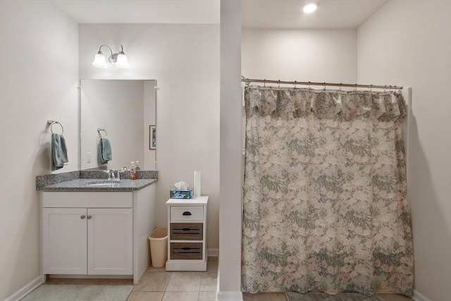 full bathroom with baseboards, a shower with shower curtain, vanity, and tile patterned floors