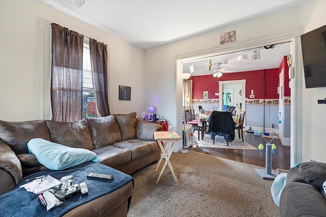 living room featuring hardwood / wood-style flooring and ceiling fan