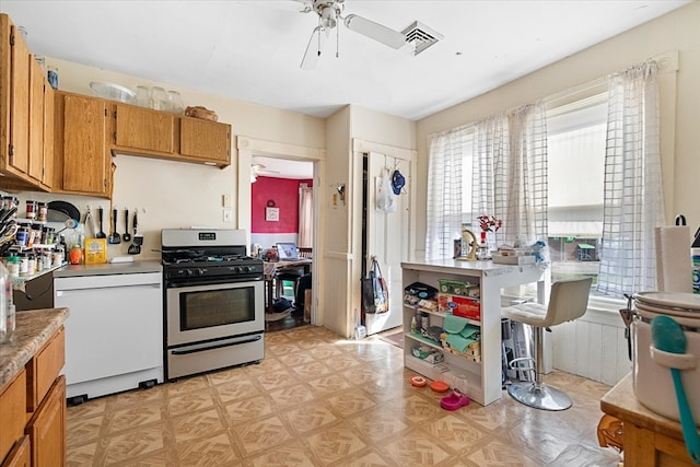 kitchen featuring dishwasher, stainless steel gas stove, and ceiling fan