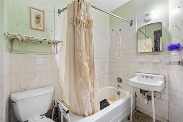 full bathroom with toilet, shower / bathtub combination with curtain, sink, and tile walls