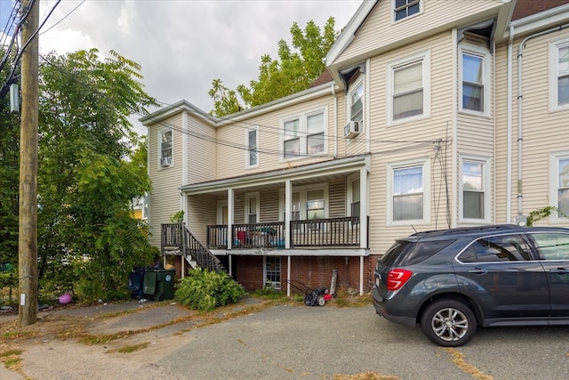 multi unit property with a porch and cooling unit