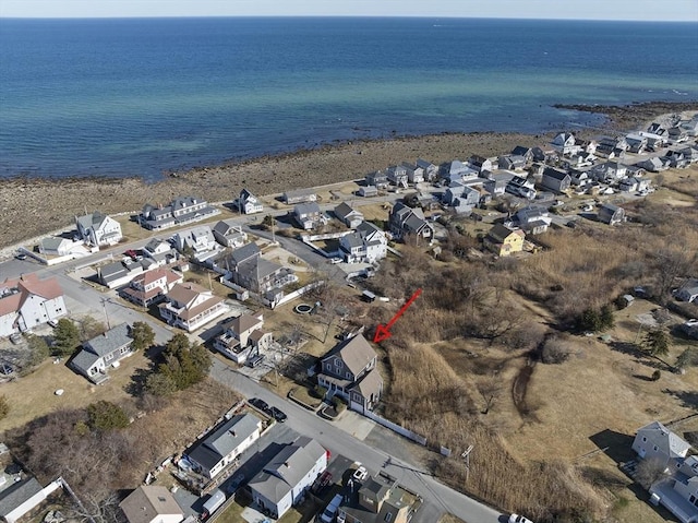 birds eye view of property with a residential view and a water view