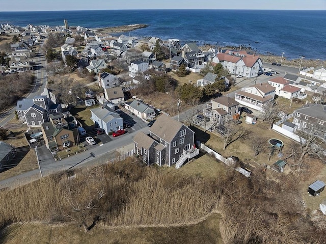 drone / aerial view featuring a residential view and a water view