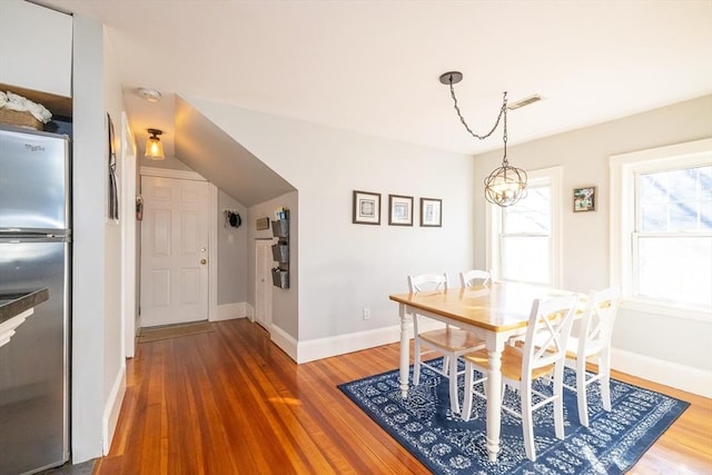 345 Ashmont St Unit 3, Boston, MA 02124 - dining area featuring baseboards, visible vents, and wood finished floors