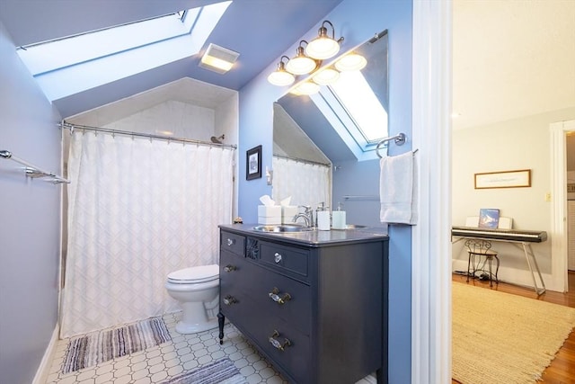 345 Ashmont St Unit 3, Boston, MA 02124 - full bath with toilet, curtained shower, vanity, and vaulted ceiling with skylight