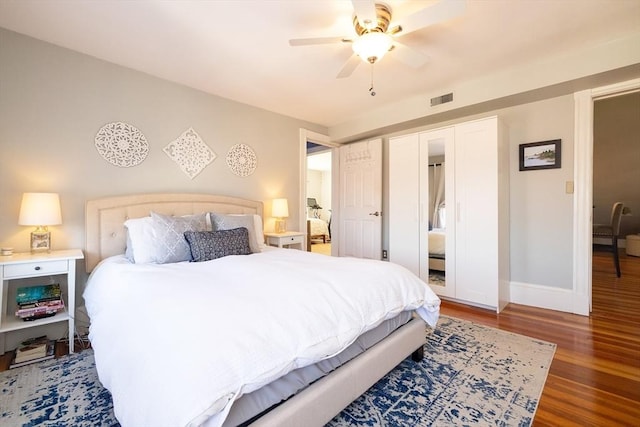 345 Ashmont St Unit 3, Boston, MA 02124 - bedroom with baseboards, ceiling fan, visible vents, and wood finished floors