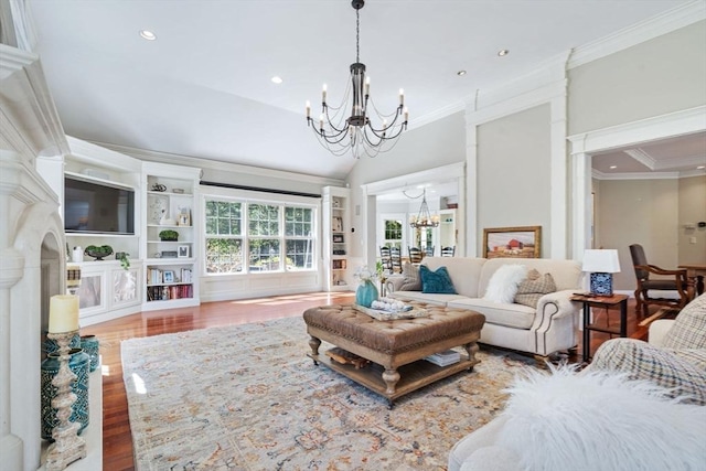 living room with a chandelier, ornamental molding, wood finished floors, recessed lighting, and lofted ceiling