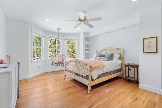 bedroom featuring light wood-style flooring, recessed lighting, baseboards, and ceiling fan