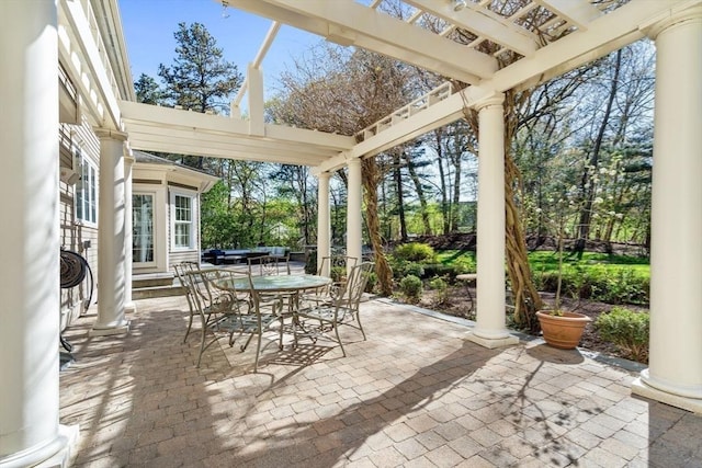 view of patio / terrace with a pergola, outdoor dining space, and entry steps