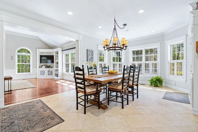 dining room with a chandelier, ornamental molding, vaulted ceiling, and recessed lighting