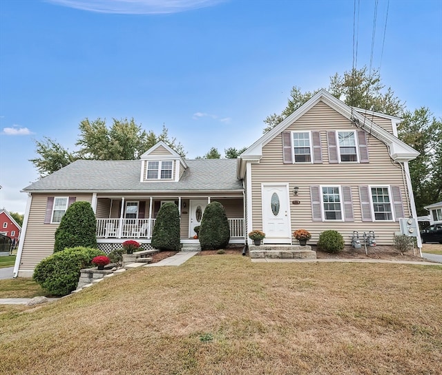 view of front facade featuring a front lawn and a porch