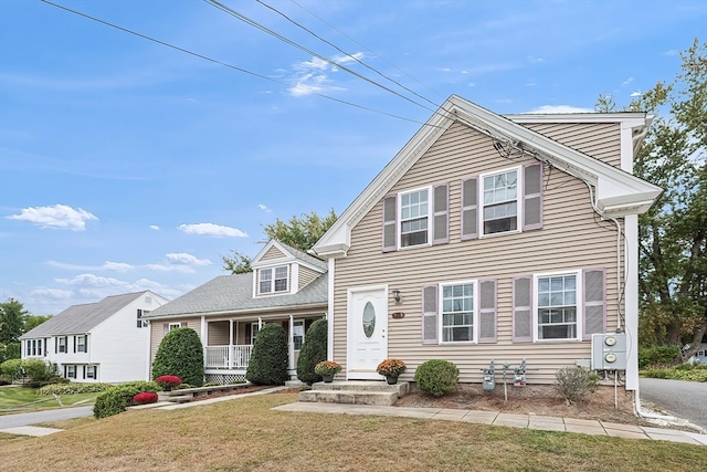 view of front of house featuring a porch and a front lawn