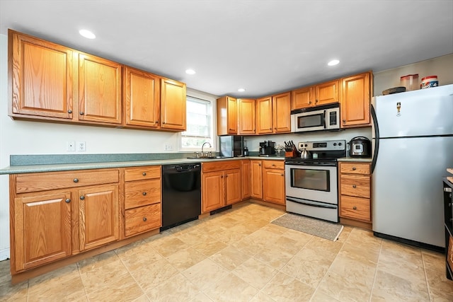 kitchen featuring stainless steel appliances and sink