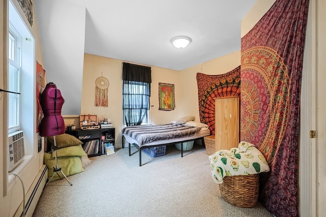 carpeted bedroom featuring a baseboard radiator