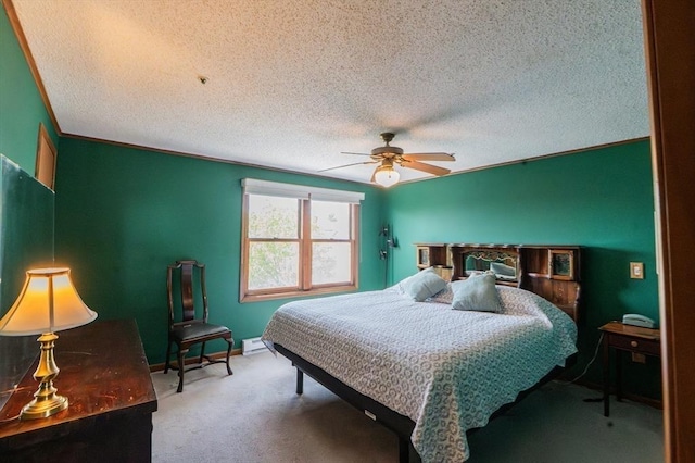 carpeted bedroom with a textured ceiling and ceiling fan