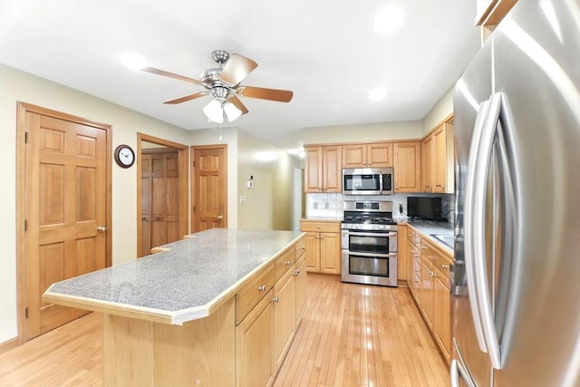 36 Apple Ridge Rd, West Springfield, MA 01089 - kitchen featuring appliances with stainless steel finishes, light wood-style floors, a kitchen island, ceiling fan, and light brown cabinets