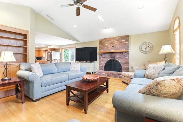 36 Apple Ridge Rd, West Springfield, MA 01089 - living area featuring a ceiling fan, vaulted ceiling, light wood-style floors, and a fireplace