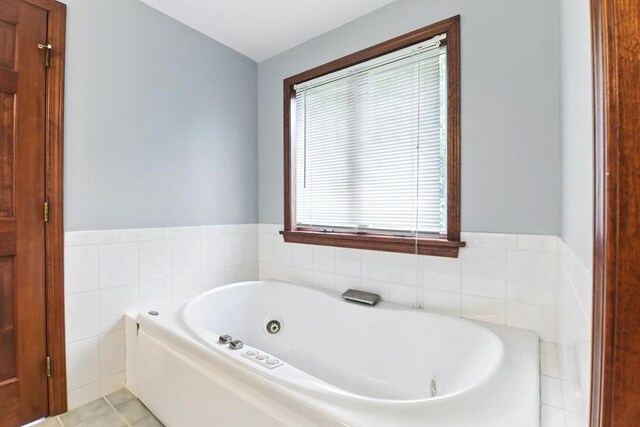 36 Apple Ridge Rd, West Springfield, MA 01089 - bathroom with a jetted tub, tile walls, and wainscoting
