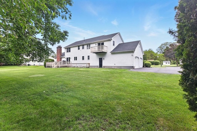 36 Apple Ridge Rd, West Springfield, MA 01089 - rear view of house featuring a balcony, a garage, driveway, and a yard
