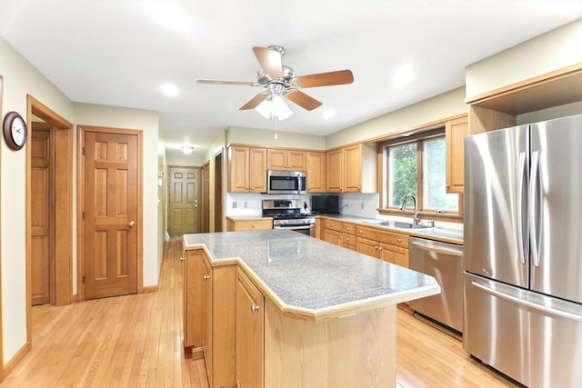 36 Apple Ridge Rd, West Springfield, MA 01089 - kitchen featuring stainless steel appliances, tile countertops, a sink, light wood-type flooring, and a kitchen island