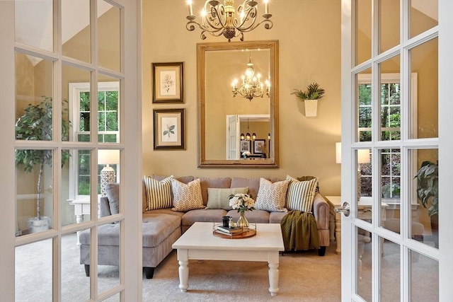 living area featuring a chandelier and a towering ceiling