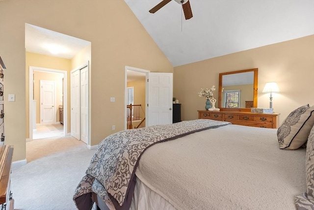 bedroom featuring carpet floors, high vaulted ceiling, a closet, baseboards, and ceiling fan