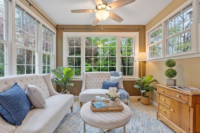 sunroom featuring baseboards and tile patterned floors