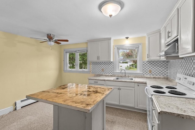 7 Burgess St, Methuen, MA 01844 - kitchen featuring electric stove, under cabinet range hood, light countertops, a baseboard heating unit, and tasteful backsplash