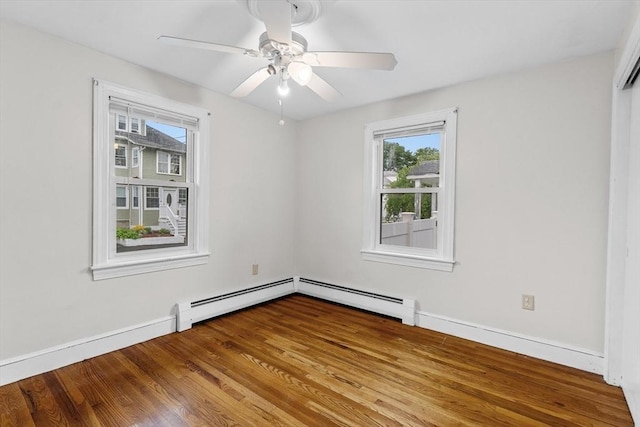 7 Burgess St, Methuen, MA 01844 - empty room with healthy amount of natural light, baseboard heating, wood finished floors, and ceiling fan