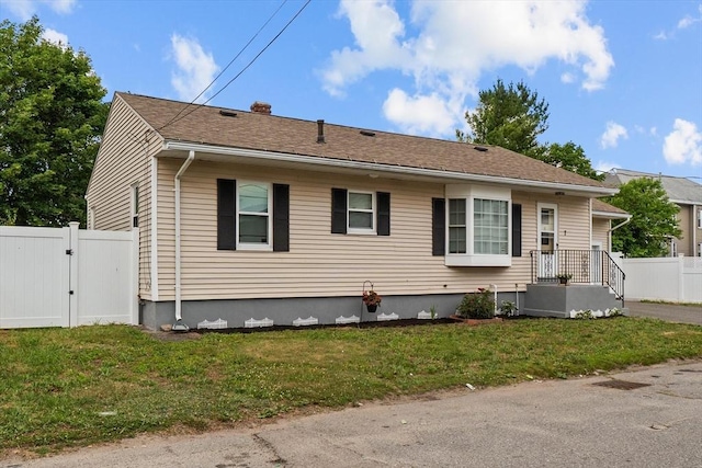 7 Burgess St, Methuen, MA 01844 - bungalow-style house featuring a gate and a chimney
