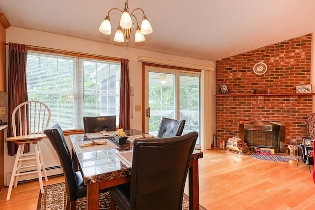 7 Chandler Way Unit 7, Northborough, MA 01532 - dining space featuring a chandelier, light wood-type flooring, a fireplace, vaulted ceiling, and a baseboard heating unit