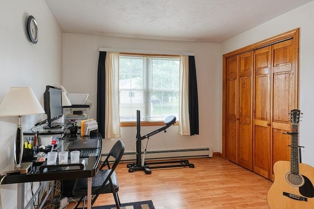 7 Chandler Way Unit 7, Northborough, MA 01532 - workout room with light wood-type flooring and a baseboard heating unit
