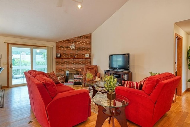 7 Chandler Way Unit 7, Northborough, MA 01532 - living area with lofted ceiling, light wood-style flooring, and a fireplace