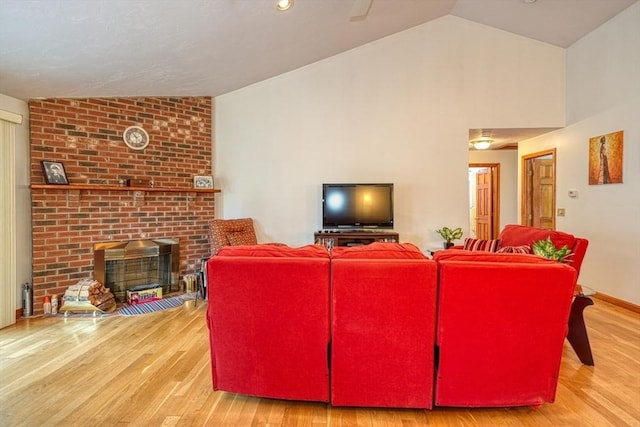 7 Chandler Way Unit 7, Northborough, MA 01532 - living room with wood finished floors, a brick fireplace, and high vaulted ceiling