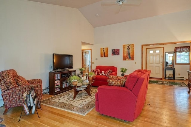 7 Chandler Way Unit 7, Northborough, MA 01532 - living area featuring wood finished floors, a ceiling fan, high vaulted ceiling, and baseboard heating