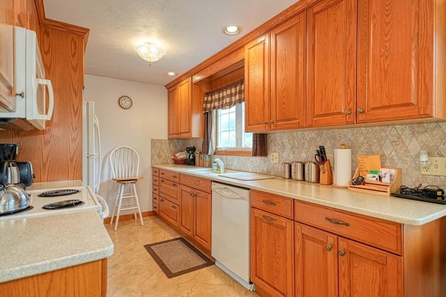 7 Chandler Way Unit 7, Northborough, MA 01532 - kitchen featuring white appliances, brown cabinets, backsplash, and recessed lighting