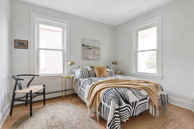 39 Calvin St Unit 3, Somerville, MA 02143 - bedroom featuring a baseboard heating unit and baseboards