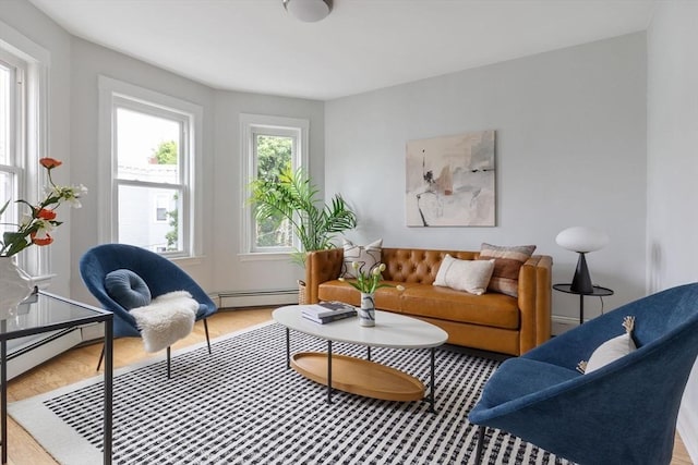 39 Calvin St Unit 3, Somerville, MA 02143 - living area with a baseboard radiator and light wood-style flooring