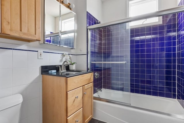 39 Calvin St Unit 3, Somerville, MA 02143 - full bath featuring vanity, shower / washtub combination, and tile walls