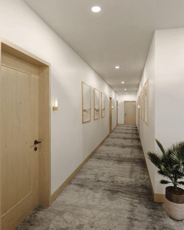 corridor with baseboards, carpet, and recessed lighting