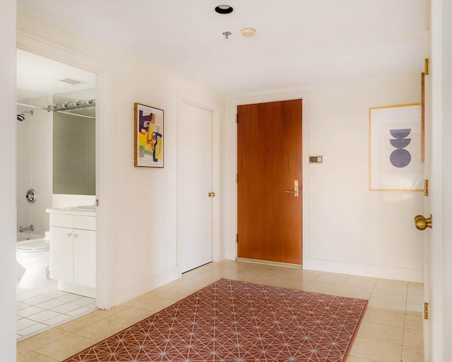 corridor featuring tile patterned flooring