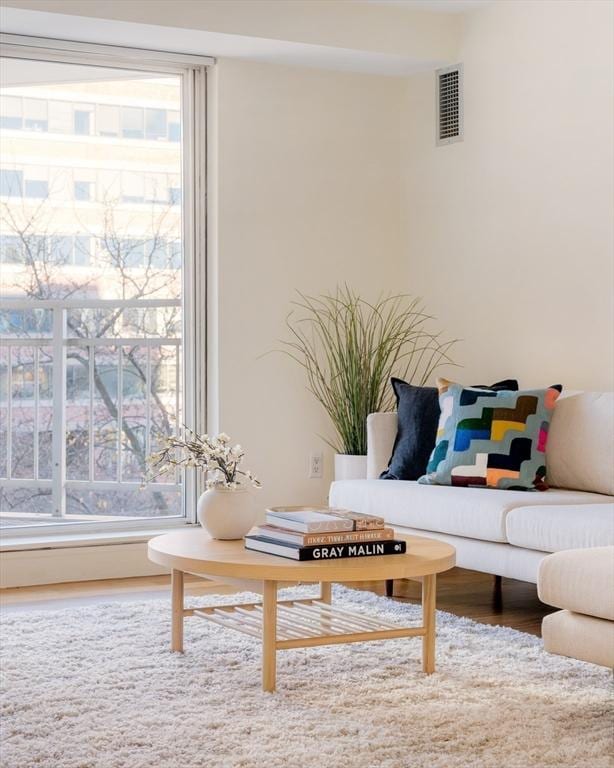 sitting room with hardwood / wood-style flooring