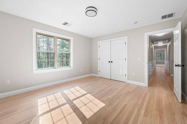 46 Mansfield Ave, Norton, MA 02766 - unfurnished bedroom featuring light wood finished floors, a closet, visible vents, and baseboards