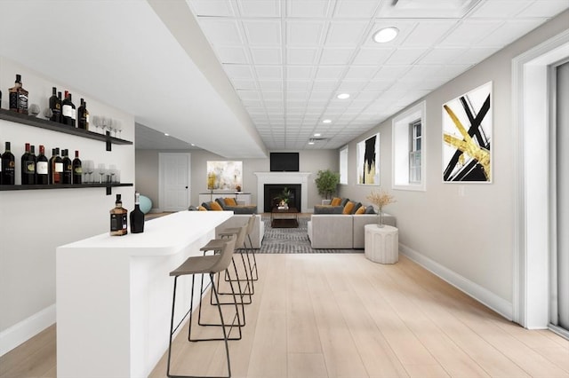 46 Mansfield Ave, Norton, MA 02766 - bar with a fireplace, light wood-type flooring, recessed lighting, and baseboards