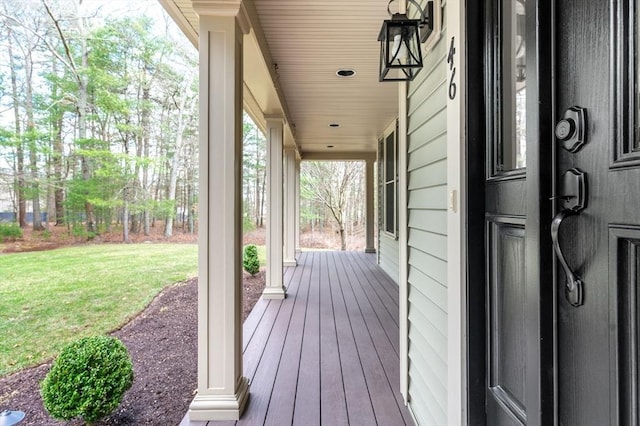 46 Mansfield Ave, Norton, MA 02766 - wooden terrace featuring a lawn and covered porch