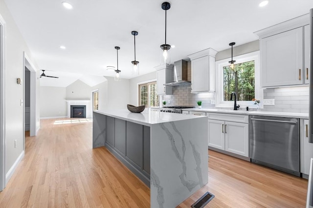 46 Mansfield Ave, Norton, MA 02766 - kitchen featuring backsplash, dishwasher, wall chimney range hood, and a sink
