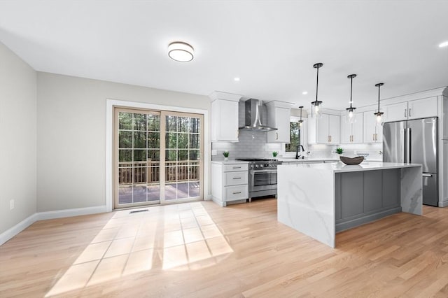 46 Mansfield Ave, Norton, MA 02766 - kitchen featuring a sink, premium appliances, light wood-style floors, a center island, and wall chimney range hood