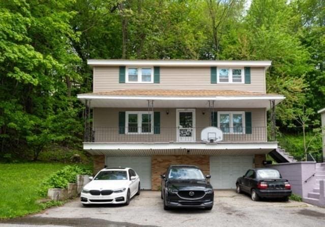 60 High Ridge Rd, Worcester, MA 01602 - view of front of home featuring driveway, a garage, and stairway